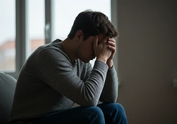 Person experiencing guilt and anxiety after compulsive use