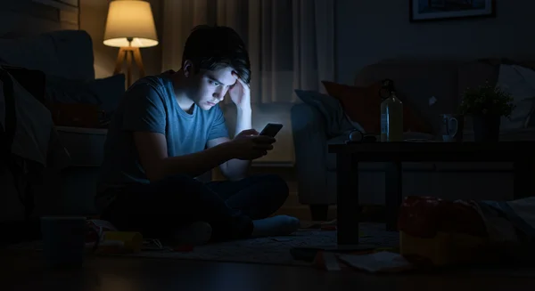 Person isolated by excessive screen time, showing negative effects.
